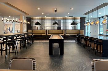 Recreation room w/ fireplace, lounge space  and banquet seating